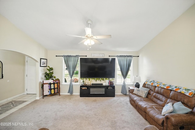 1537 Elmar Rd, Jacksonville, FL 32226 - living room with arched walkways, carpet, a ceiling fan, and baseboards