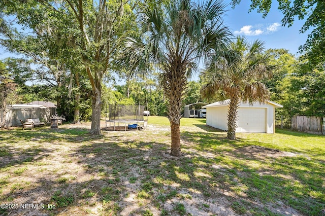 1537 Elmar Rd, Jacksonville, FL 32226 - view of yard with a trampoline and a garage