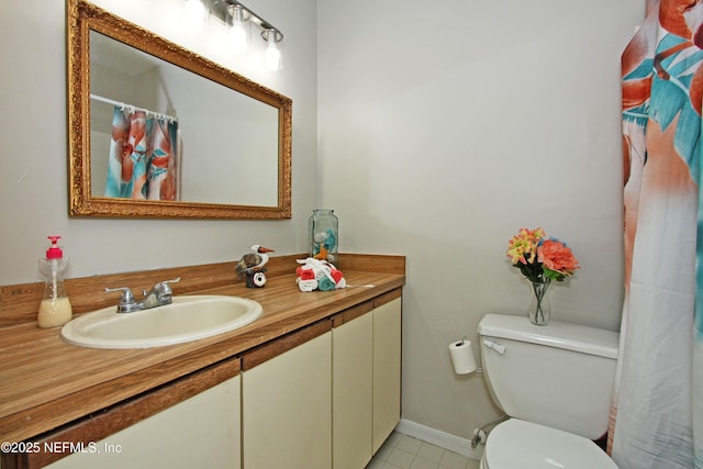 2105 Sandpiper Ct, Ponte Vedra Beach, FL 32082 - full bathroom with vanity, toilet, tile patterned flooring, baseboards, and a shower with shower curtain