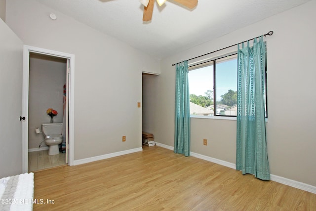 2105 Sandpiper Ct, Ponte Vedra Beach, FL 32082 - unfurnished bedroom with light wood-style floors, lofted ceiling, connected bathroom, baseboards, and ceiling fan