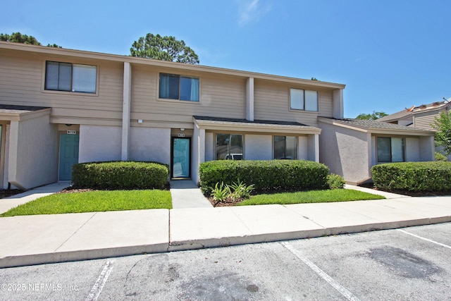 2105 Sandpiper Ct, Ponte Vedra Beach, FL 32082 - townhome / multi-family property with uncovered parking and stucco siding