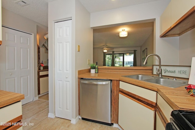 2105 Sandpiper Ct, Ponte Vedra Beach, FL 32082 - kitchen featuring stainless steel dishwasher, a sink, stove, a textured ceiling, and a ceiling fan