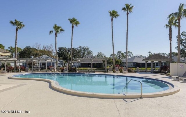 2105 Sandpiper Ct, Ponte Vedra Beach, FL 32082 - community pool with a pergola and a patio