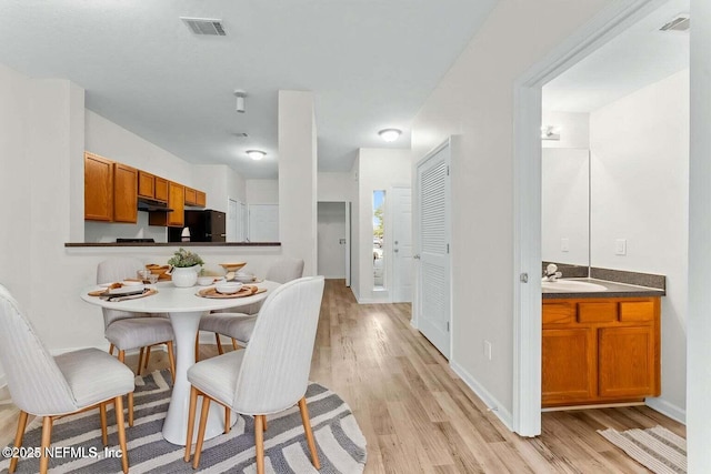 4778 Playpen Dr, Jacksonville, FL 32210 - dining space featuring light wood-style floors and baseboards