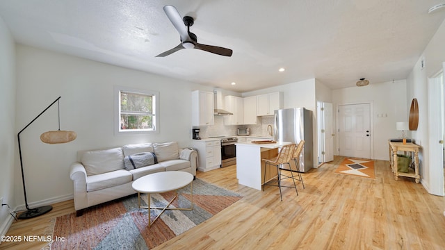 119 Moore St, Saint Augustine, FL 32084 - living area with light wood-style floors, ceiling fan, baseboards, and recessed lighting