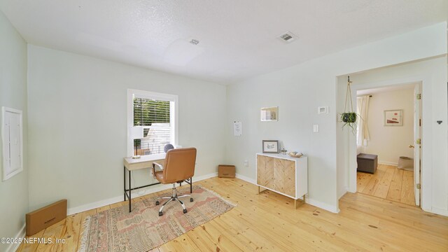 119 Moore St, Saint Augustine, FL 32084 - home office featuring light wood finished floors and baseboards