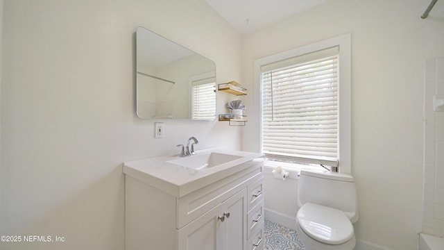 119 Moore St, Saint Augustine, FL 32084 - bathroom with vanity, toilet, and baseboards