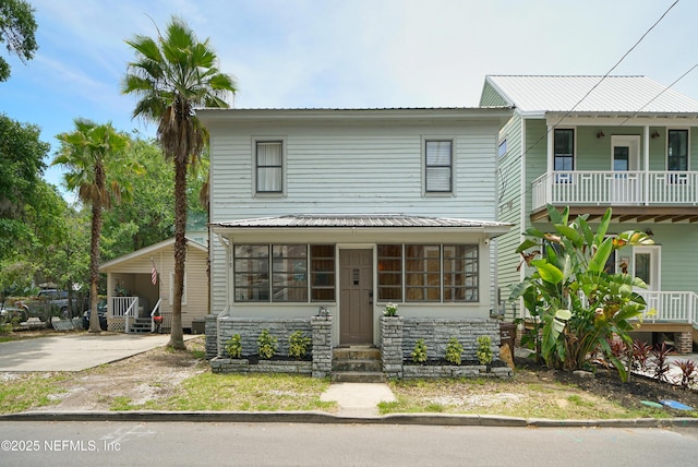119 Moore St, Saint Augustine, FL 32084 - view of front facade featuring entry steps and a balcony