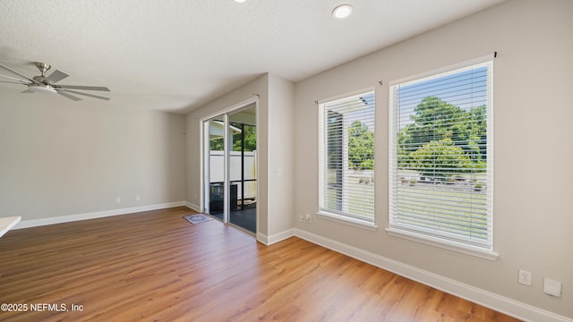 18 Amistad Dr, Saint Augustine, FL 32086 - unfurnished room with baseboards, light wood-type flooring, ceiling fan, a textured ceiling, and recessed lighting