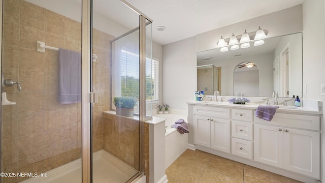 18 Amistad Dr, Saint Augustine, FL 32086 - bathroom featuring double vanity, a shower stall, tile patterned flooring, and a garden tub