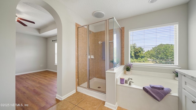 18 Amistad Dr, Saint Augustine, FL 32086 - full bathroom with a bath, a stall shower, plenty of natural light, and ceiling fan