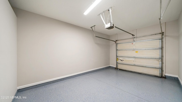 18 Amistad Dr, Saint Augustine, FL 32086 - garage with a garage door opener and baseboards
