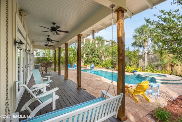 211 Tenth St, Saint Augustine, FL 32084 - wooden terrace with a fenced backyard, ceiling fan, a pool with connected hot tub, and a patio