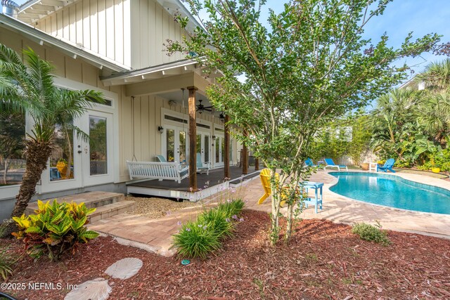 211 Tenth St, Saint Augustine, FL 32084 - swimming pool featuring french doors, a patio area, and ceiling fan