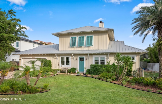 211 Tenth St, Saint Augustine, FL 32084 - view of front of house with a chimney, a standing seam roof, an attached garage, board and batten siding, and metal roof