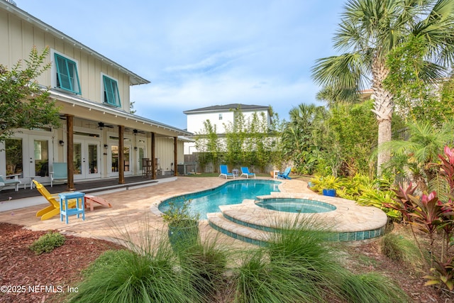 211 Tenth St, Saint Augustine, FL 32084 - view of pool with french doors, a ceiling fan, a patio area, and a pool with connected hot tub