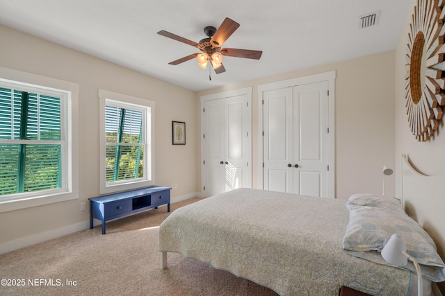 211 Tenth St, Saint Augustine, FL 32084 - carpeted bedroom with multiple closets, baseboards, and ceiling fan