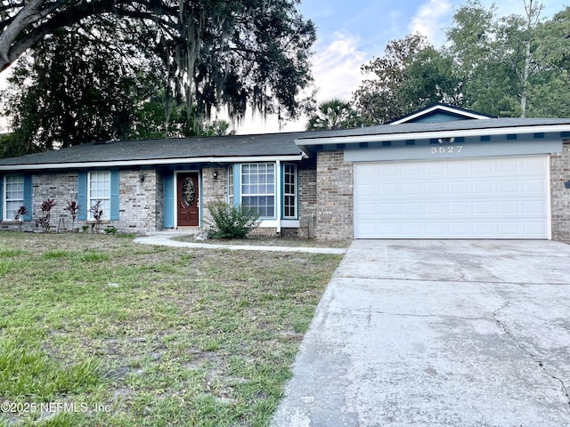 3527 Sheldon Rd, Orange Park, FL 32073 - ranch-style home with driveway, a garage, brick siding, and a front yard
