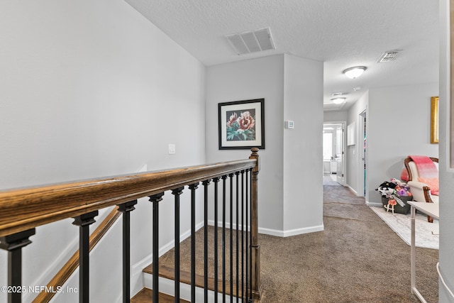 11286 Minnetta Ct, Jacksonville, FL 32256 - corridor featuring an upstairs landing, a textured ceiling, carpet flooring, and baseboards