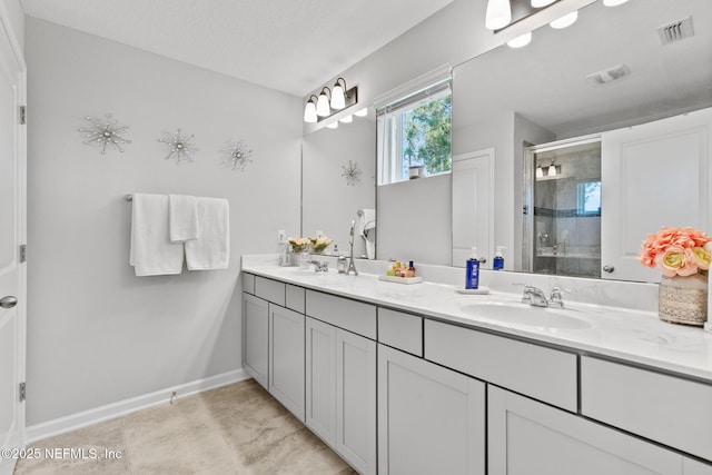 11286 Minnetta Ct, Jacksonville, FL 32256 - bathroom featuring double vanity, a stall shower, and baseboards