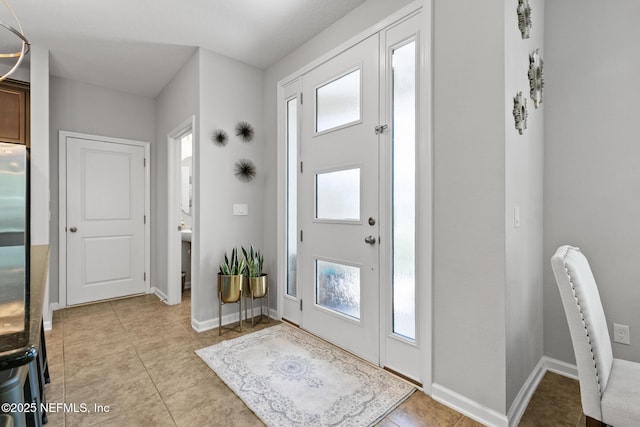 11286 Minnetta Ct, Jacksonville, FL 32256 - entryway with light tile patterned flooring and baseboards