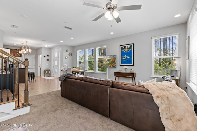 11286 Minnetta Ct, Jacksonville, FL 32256 - living area featuring recessed lighting, stairs, a chandelier, a ceiling fan, and light colored carpet