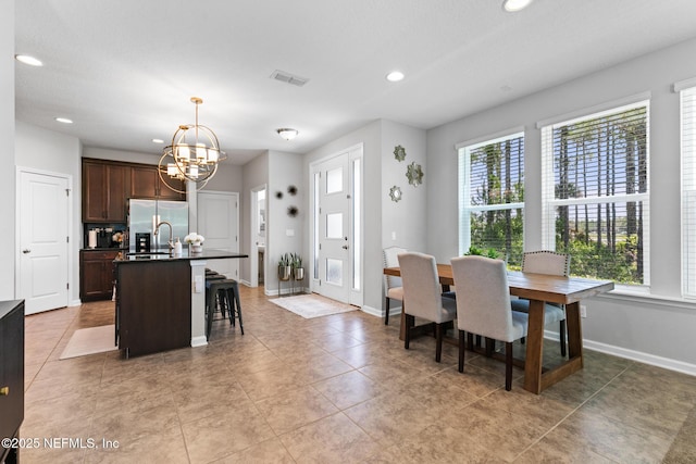 11286 Minnetta Ct, Jacksonville, FL 32256 - dining room featuring a chandelier, recessed lighting, baseboards, and light tile patterned floors