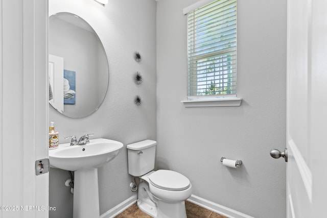 11286 Minnetta Ct, Jacksonville, FL 32256 - bathroom featuring baseboards, toilet, and tile patterned flooring