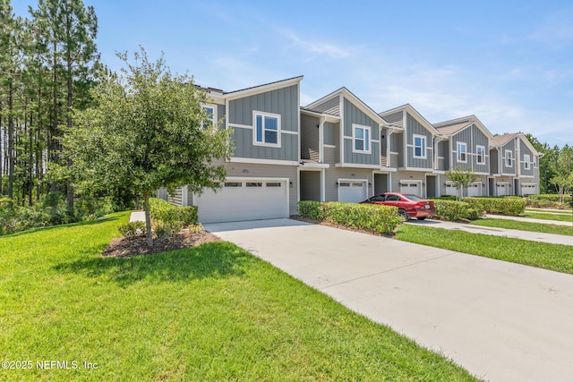 11286 Minnetta Ct, Jacksonville, FL 32256 - multi unit property featuring board and batten siding, an attached garage, a residential view, driveway, and a front yard