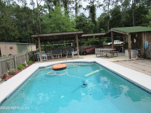 7041 Catlett Rd, Saint Augustine, FL 32095 - view of swimming pool featuring a pergola, a wooden deck, and view of scattered trees