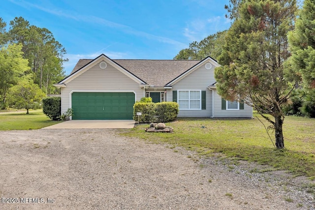 7041 Catlett Rd, Saint Augustine, FL 32095 - ranch-style house with driveway, an attached garage, a front lawn, and a shingled roof