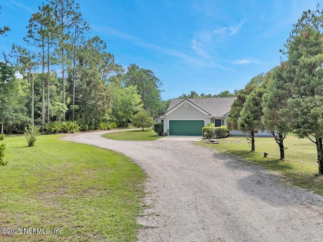 7041 Catlett Rd, Saint Augustine, FL 32095 - view of front of home with driveway, a front lawn, and an attached garage