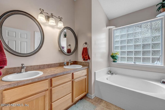 7041 Catlett Rd, Saint Augustine, FL 32095 - full bath featuring a garden tub, tile patterned flooring, and double vanity
