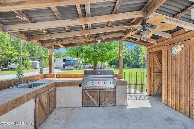 7041 Catlett Rd, Saint Augustine, FL 32095 - view of patio featuring a sink, ceiling fan, and view of wooded area
