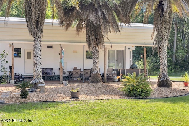 7041 Catlett Rd, Saint Augustine, FL 32095 - view of front of home featuring a front yard and a patio area
