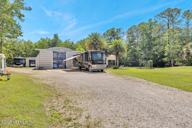 7041 Catlett Rd, Saint Augustine, FL 32095 - exterior space featuring driveway and view of scattered trees