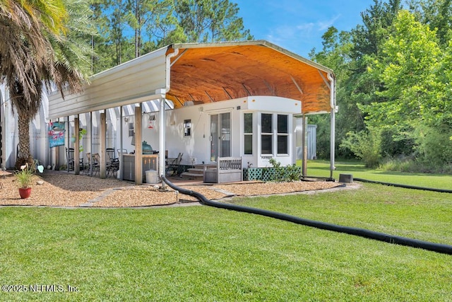 7041 Catlett Rd, Saint Augustine, FL 32095 - view of front facade featuring a front yard and a carport