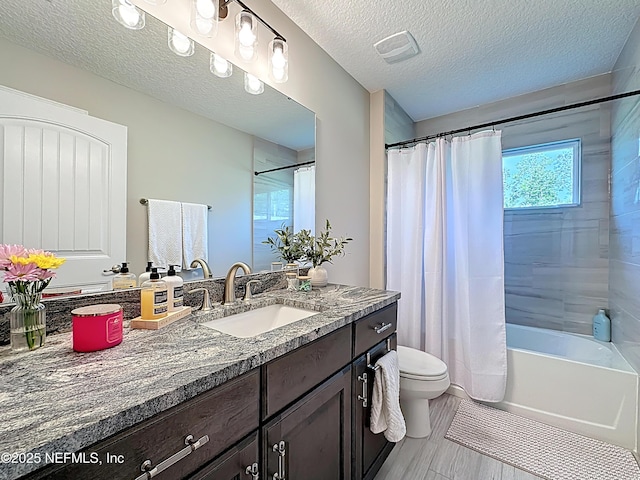 9413 Alma St, Jacksonville, FL 32220 - full bathroom with vanity, toilet, shower / tub combo, a textured ceiling, and wood finished floors
