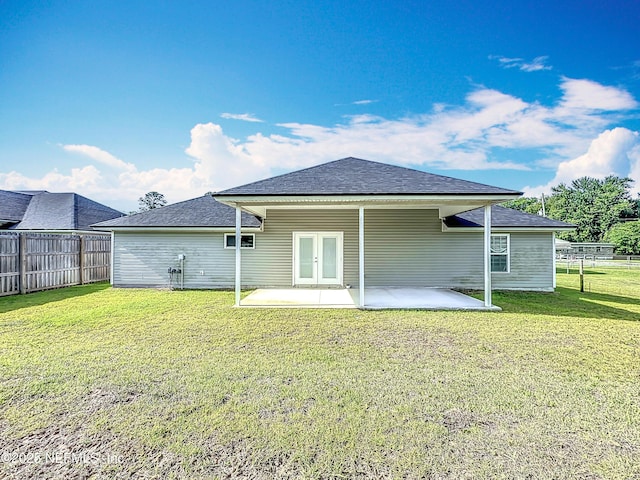9413 Alma St, Jacksonville, FL 32220 - back of house with a patio area, a shingled roof, and french doors