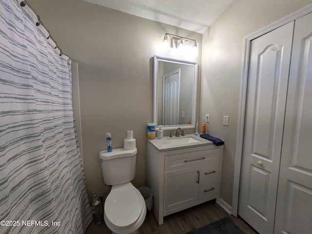 12429 Pecan Hickory Ct, Jacksonville, FL 32226 - bathroom featuring vanity, toilet, and wood finished floors