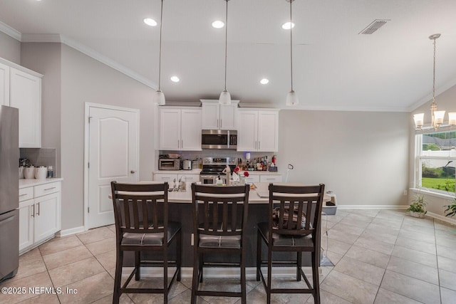 380 Crescent Key Dr, Saint Augustine, FL 32086 - dining room with light tile patterned floors, ornamental molding, baseboards, a chandelier, and recessed lighting