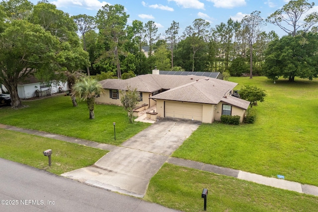 419 Sevilla Dr, Saint Augustine, FL 32086 - ranch-style house with a garage, a front yard, concrete driveway, roof with shingles, and a chimney