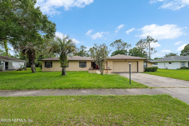 419 Sevilla Dr, Saint Augustine, FL 32086 - ranch-style house featuring a garage, concrete driveway, and a front yard