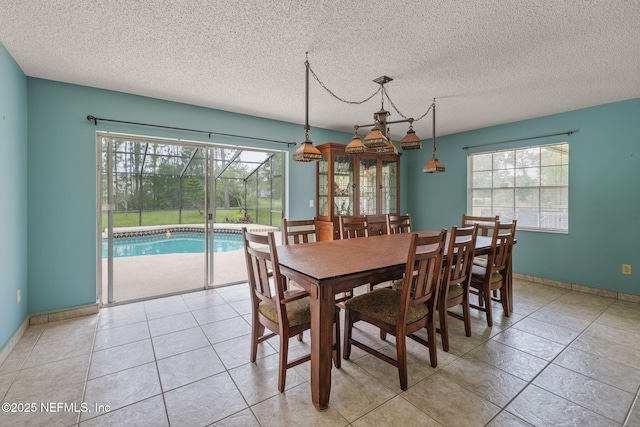 419 Sevilla Dr, Saint Augustine, FL 32086 - dining room with a textured ceiling and light tile patterned flooring