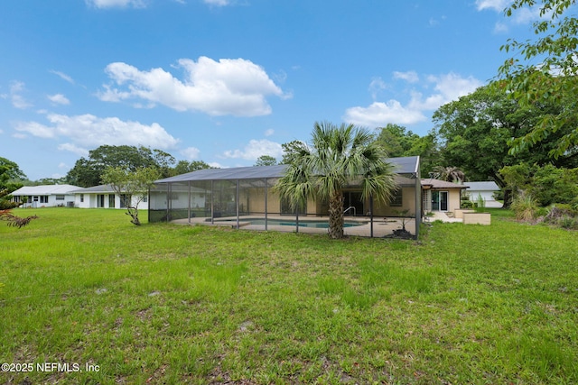 419 Sevilla Dr, Saint Augustine, FL 32086 - rear view of property with an outdoor pool, a lanai, a yard, and a patio