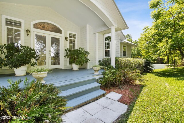 4333 Seminole St, Starke, FL 32091 - doorway to property with covered porch and a lawn