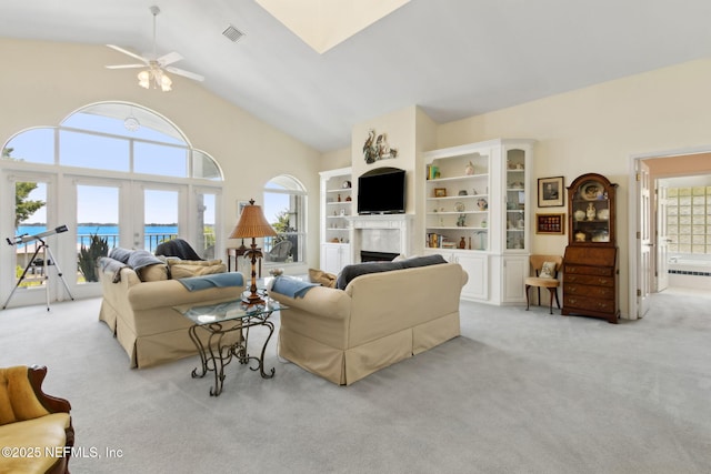 4333 Seminole St, Starke, FL 32091 - living room featuring plenty of natural light, light carpet, a ceiling fan, and high vaulted ceiling
