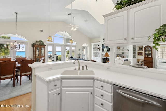 4333 Seminole St, Starke, FL 32091 - kitchen featuring stainless steel dishwasher, a sink, a chandelier, light wood-style flooring, and ceiling fan