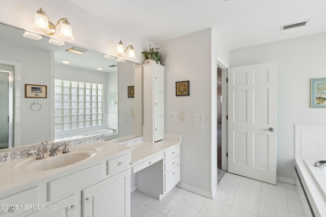 4333 Seminole St, Starke, FL 32091 - bathroom featuring vanity, a garden tub, and tile patterned flooring