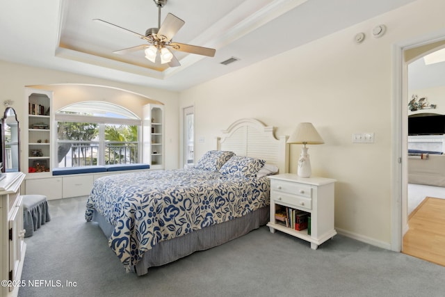 4333 Seminole St, Starke, FL 32091 - carpeted bedroom featuring a raised ceiling, a ceiling fan, and arched walkways